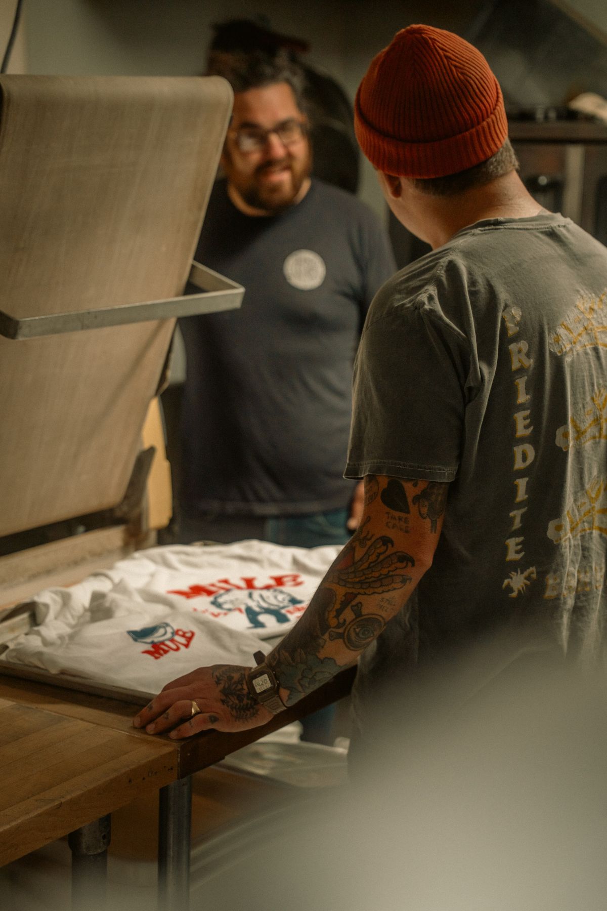 Screen printing production for finished custom apparel orders.